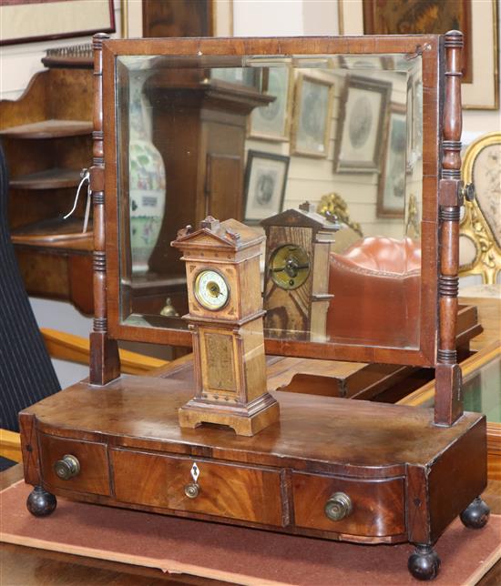 A Regency mahogany box base toilet mirror fitted three drawers, on ball feet and a Victorian walnut miniature longcase clock W.62cm, H.